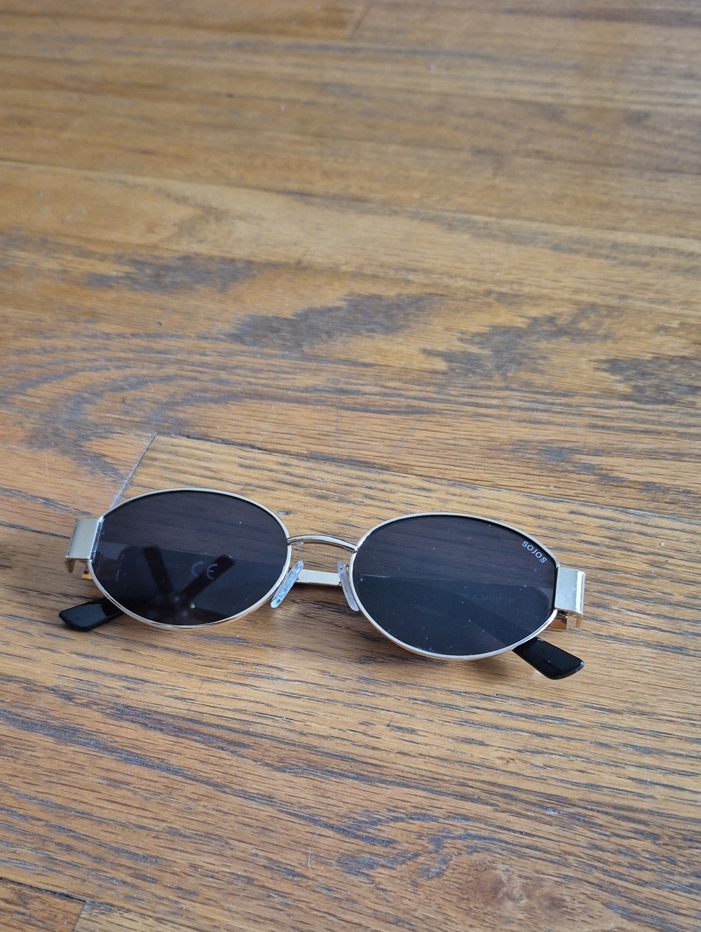 Oval Gold Frame Sunglasses with Black Lenses